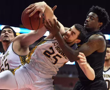 Mar 10, 2017; Anaheim, CA, USA; UC Irvine Anteaters guard Spencer Rivers (25) and Long Beach State 49ers forward Mason Riggins (5) battle for a rebound. Robert Hanashiro-USA TODAY Sports