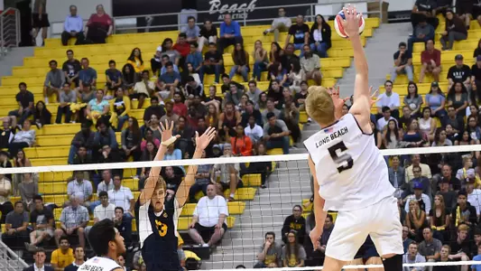 Apr 20, 2017; Long Beach, CA, USA;  UC Irvine Anteaters middle blocker Scott Stadick (13) looks to block a hit by Long Beach St. 49ers middle blocker Kyle Ensing (5) during the semi-final at Walter Pyramid. Long Beach St. 49ers won 3-0. Mandatory Credit: Jayne Kamin-Oncea-USA TODAY Sports