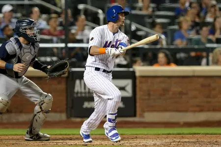 Jul 24, 2018; New York City, NY, USA; New York Mets pinch hitter Jeff McNeil (68) follows through on a single against the San Diego Padres during the ninth inning at Citi Field. The hit was his first major league hit. Mandatory Credit: Brad Penner-USA TODAY Sports