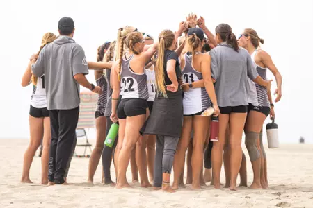 Beach Volleyball Team Huddle