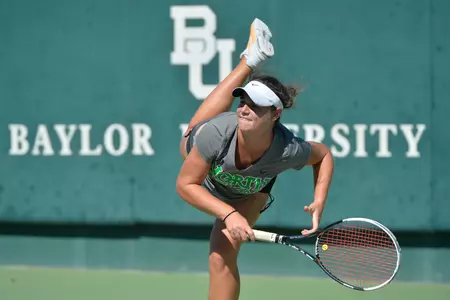 Sophomore Ana Sofia Cordero follows through on a serve during her first round match. She won in consolation singles on Friday.