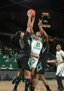 Forward Joh'Vonna Darrington is blocked in this photo against Charlotte, but the senior swatted a career-high four shots tonight against Southern Miss.