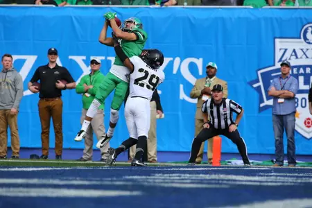 Rico Bussey, Jr., pulls in a touchdown pass from Alec Morris