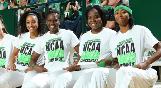 (From left) Tyara Warren, Stabresa McDaniel, Kiara Davis and Terriell Bradley display their shirts commemorating the 1986 NCAA Tournament team in a game versus Rice on Jan. 30. (Photo by Rick Yeatts)