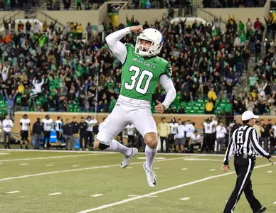 Senior kicker Trevor Moore celebrates after hitting the game-winning field goal Saturday against Army (photo by Rick Yeatts)