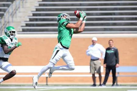 Wide receiver Turner Smiley pulls in one of his four receptions in Saturday's Green-White spring game at Apogee Stadium.