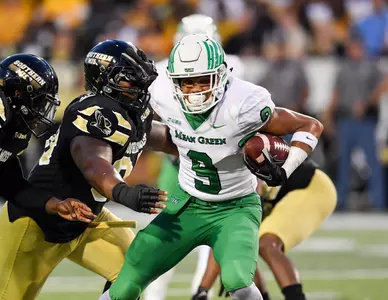 Wide receiver Jalen Guyton stiff-arms a Southern Miss defender Saturday night (photo Manny Flores/Rick Yeatts)