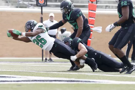 Evan Johnson stretches for the goal line to score the first touchdown of the 2018 spring game.