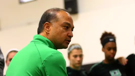 Coach Palileo in huddle vs. Texas Tech