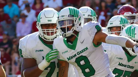 Rico Bussey Jr. celebrates a TD at Arkansas