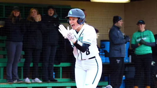 Hanna Rebar celebrates after hitting a home run