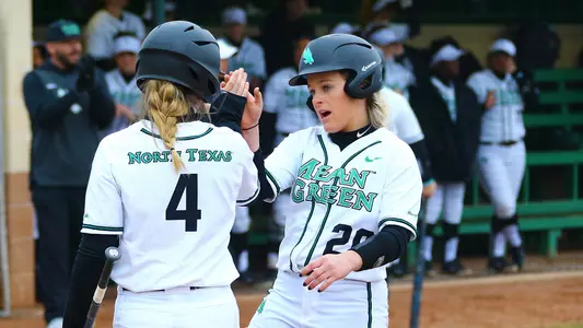 Kenzie Young is congratulated by Katie Clark after scoring