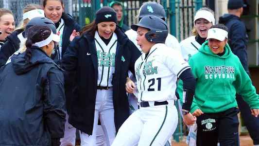 North Texas infielder Rhylie Makawe scores after hitting a home run