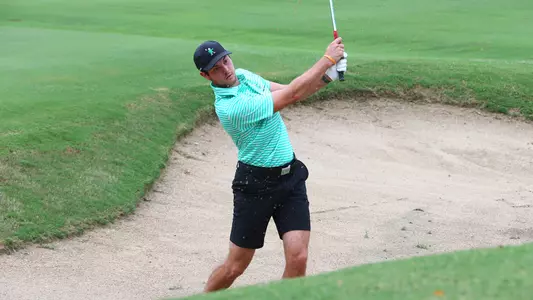 Sean Wilcox hitting out of the sand
