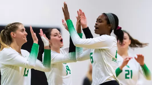 Alysha Johnson high fives teammates
