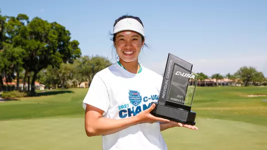 Audrey Tan with her individual championship trophy at C-USA Championship