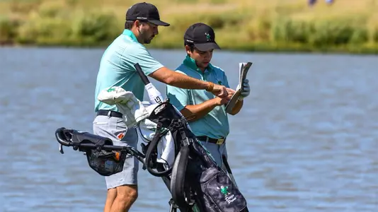 Assistant coach Zach Wright talks with Diego Prone at the Maridoe
