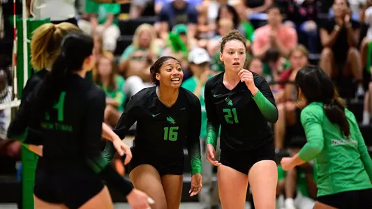 Volleyball team celebrates eVolleyball team celebrates earning a pointarning a point