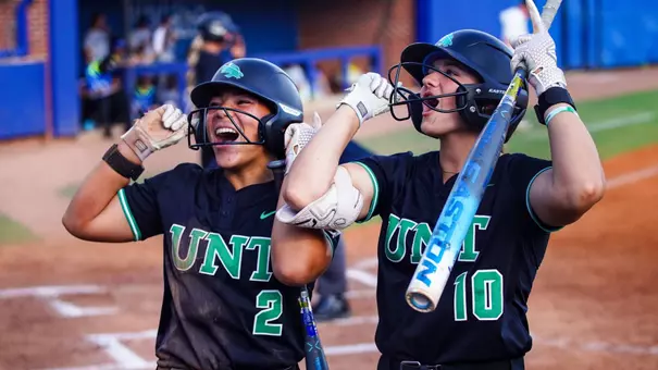Ariah Mitchell and Kaycee Slovak celebrate scoring runs at Memphis on April 17
