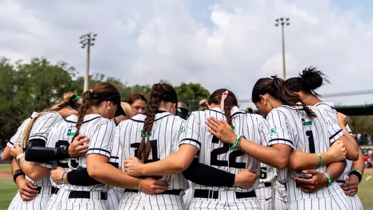 Softball huddles ahead of its game at South Florida on May 2