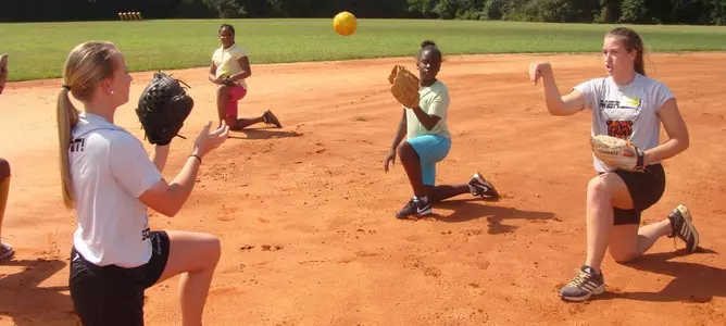Softball Players Instruct at Local Middle School Image