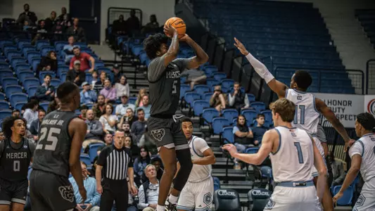 Jalyn McCreary shooting a jump shot with the ball in his left hand