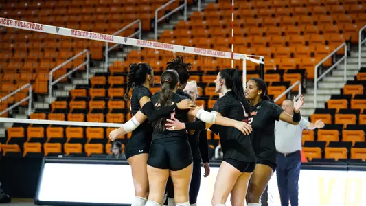 volleyball team court huddle