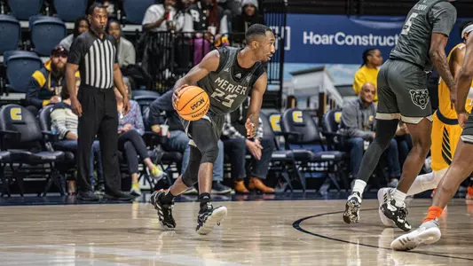 Shawn Walker Jr. mid dribble at the top of the arc