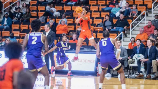 Jah Quinones jumping while passing the ball
