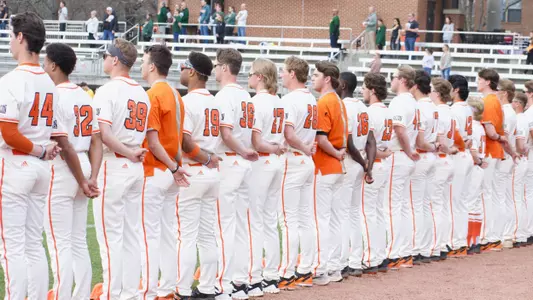 Baseball team lined up during the national anthem