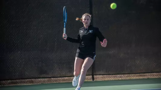 Mary Weston Courville running up to hit a forehand shot