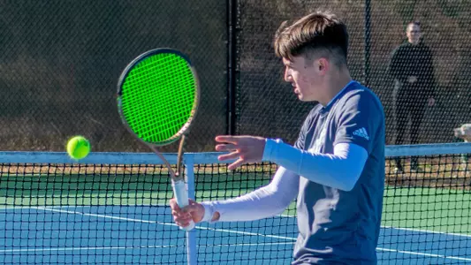 Nemanja Stefanovic hitting a backhand shot