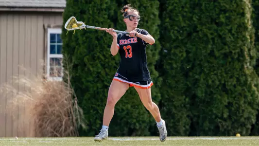 Carly Curran running with ball