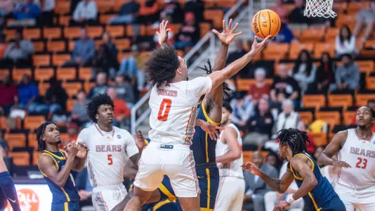 Jah Quinones jumping up to score a layup