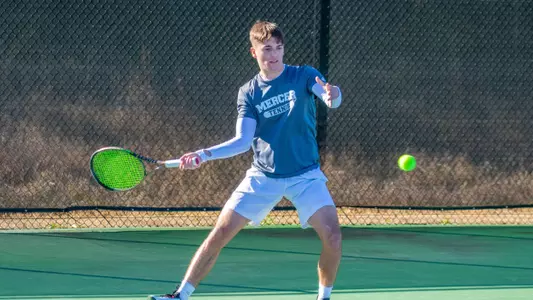 Nemanja Stefanovic swinging to hit a forehand shot with his right hand