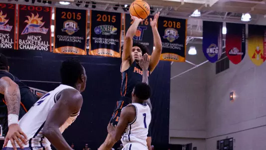 Kamar Robertson shooting a jumper over the heads of Samford defenders