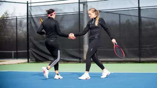 Eden Schlagenhauf and Camilla Ciaccia high-fiving after a point