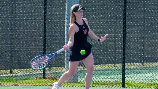 Mary Weston Courville about to hit a forehand shot