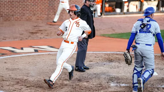 Jozsef Rohrbacher crossing home plate
