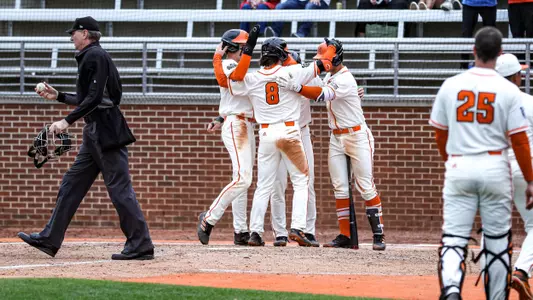 Eli Runyan, Treyson Hughes, Max Kops, and Carter Geier celebrating after a home run
