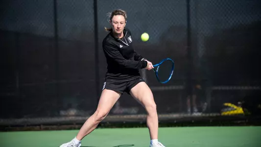 Mary Weston Courville about to hit a backhand shot