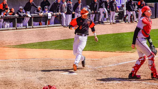 Jozsef Rohrbacher crossing home plate