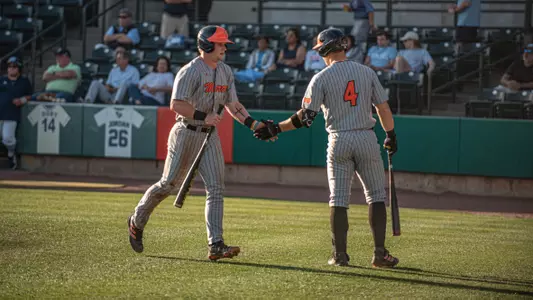 Carter Geier giving Jackson Cherry a high five after scoring