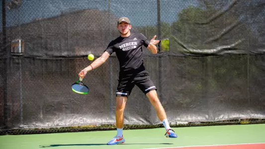 Samuel MacLeod hitting a forehand shot