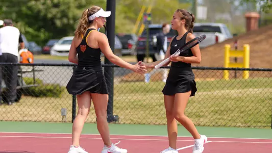 Teodora Ristic and Mary Weston Courville high fiving after a point