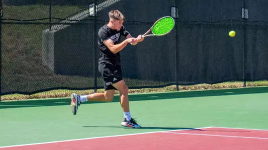 Nemanja Stefanovic on the follow through of a backhand shot