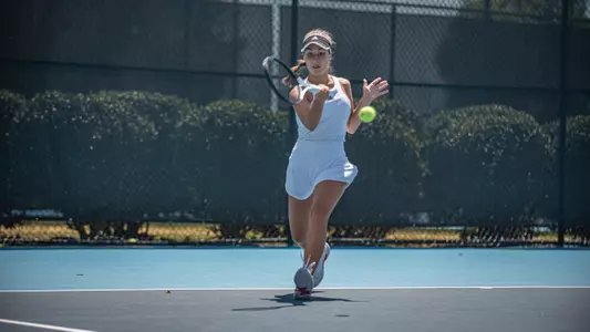 Teodora Ristic hitting a forehand shot on the move