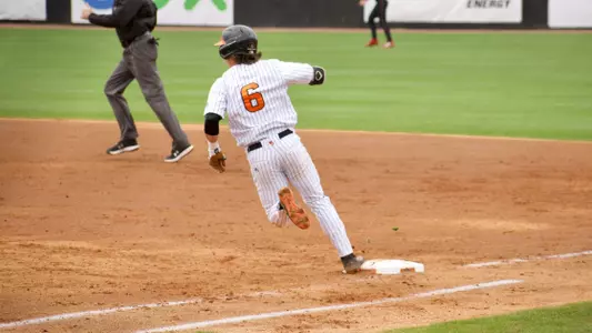 Jozsef Rohrbacher touching first base while running