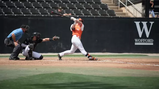 Jackson Cherry in the follow-through of his swing