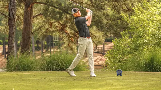 Tobias Jonsson on the follow through of his swing